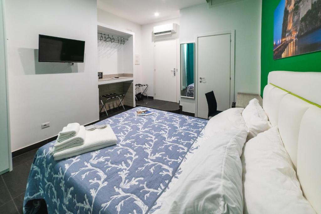 Postel nebo postele na pokoji v ubytování B&b Onda Napoli