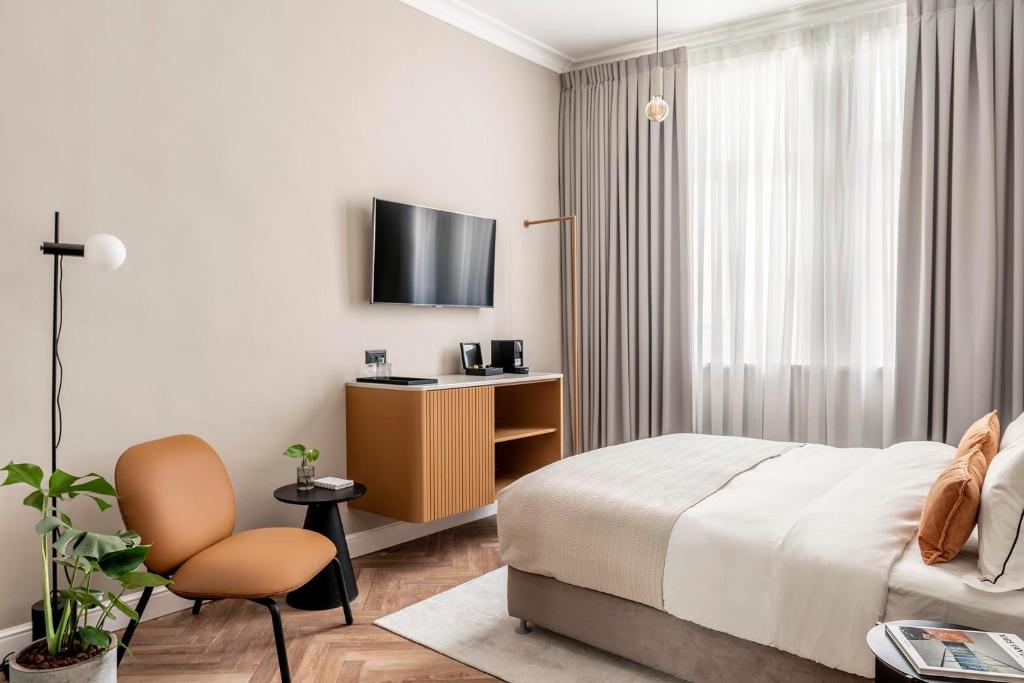 TV a/nebo společenská místnost v ubytování Hotel Noel - A Boutique Experience by Albi Collection