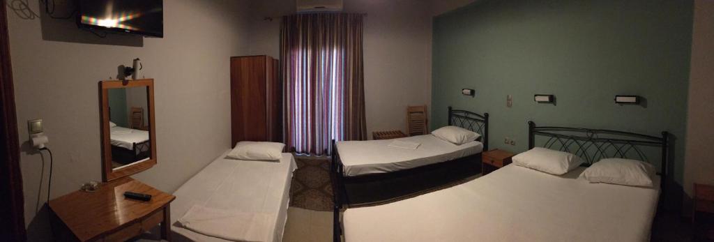 A bed or beds in a room at Artemis