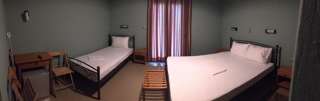 A bed or beds in a room at Artemis