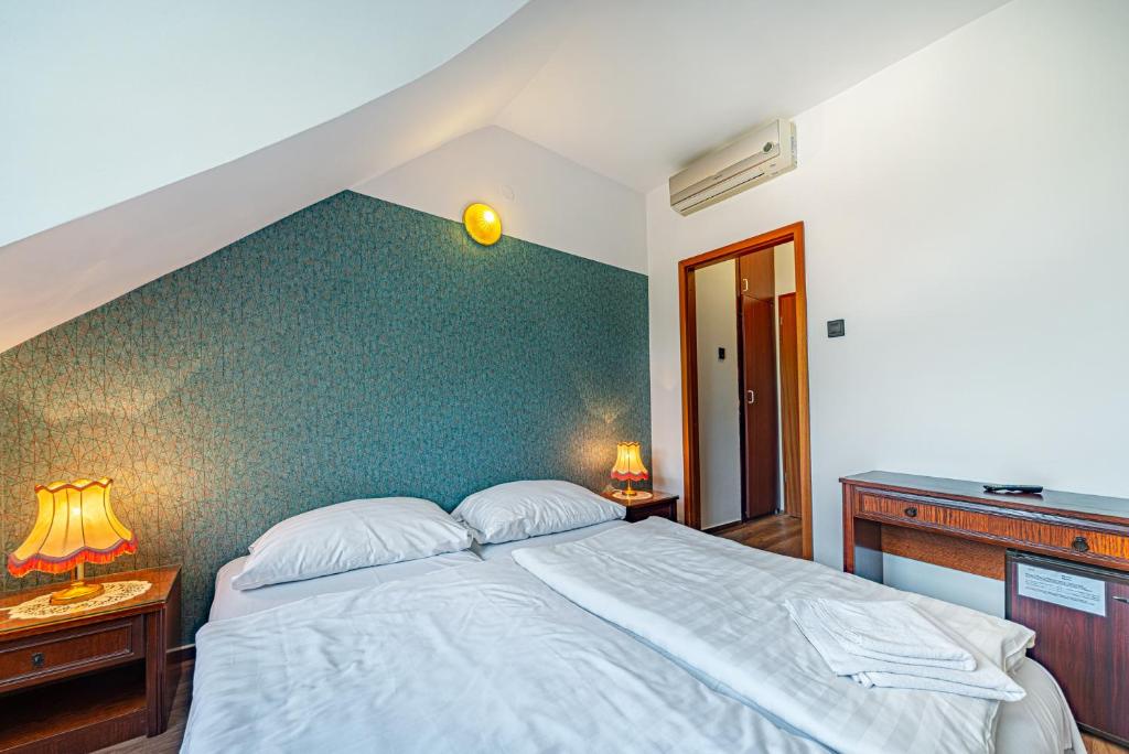 Posteľ alebo postele v izbe v ubytovaní Hotel Bobbio