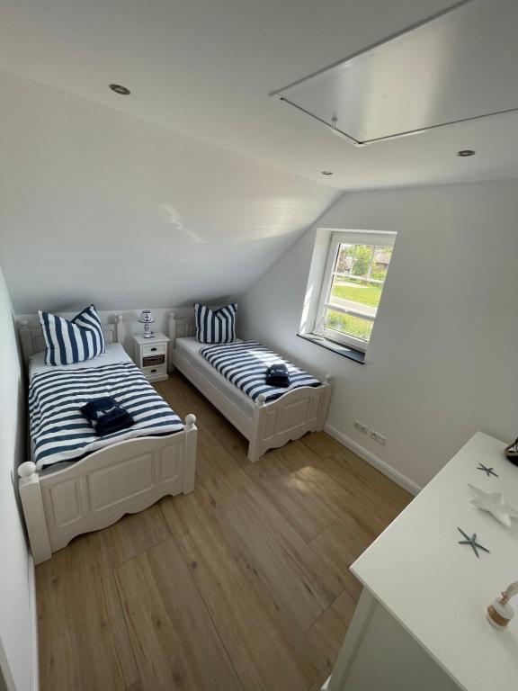 Postel nebo postele na pokoji v ubytování Ferienhaus Joline