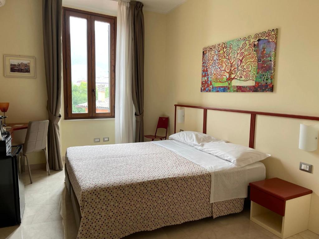 Postel nebo postele na pokoji v ubytování B&B Ponte Capograssi