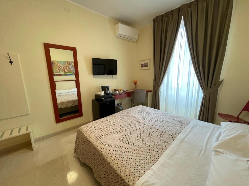 Postel nebo postele na pokoji v ubytování B&B Ponte Capograssi
