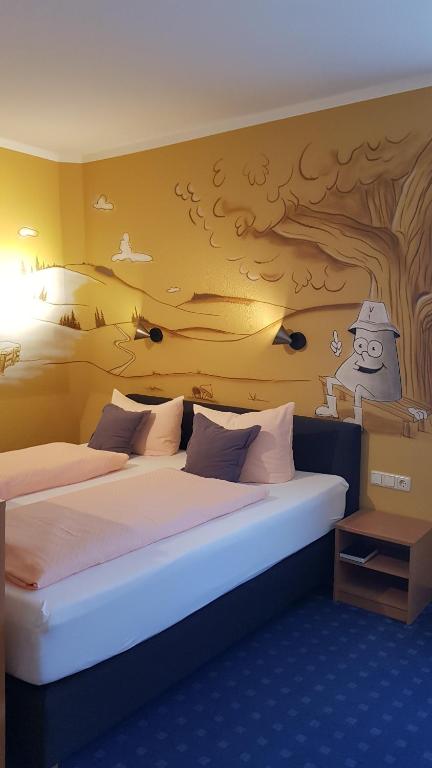 Postel nebo postele na pokoji v ubytování Hotel Vierenstraße