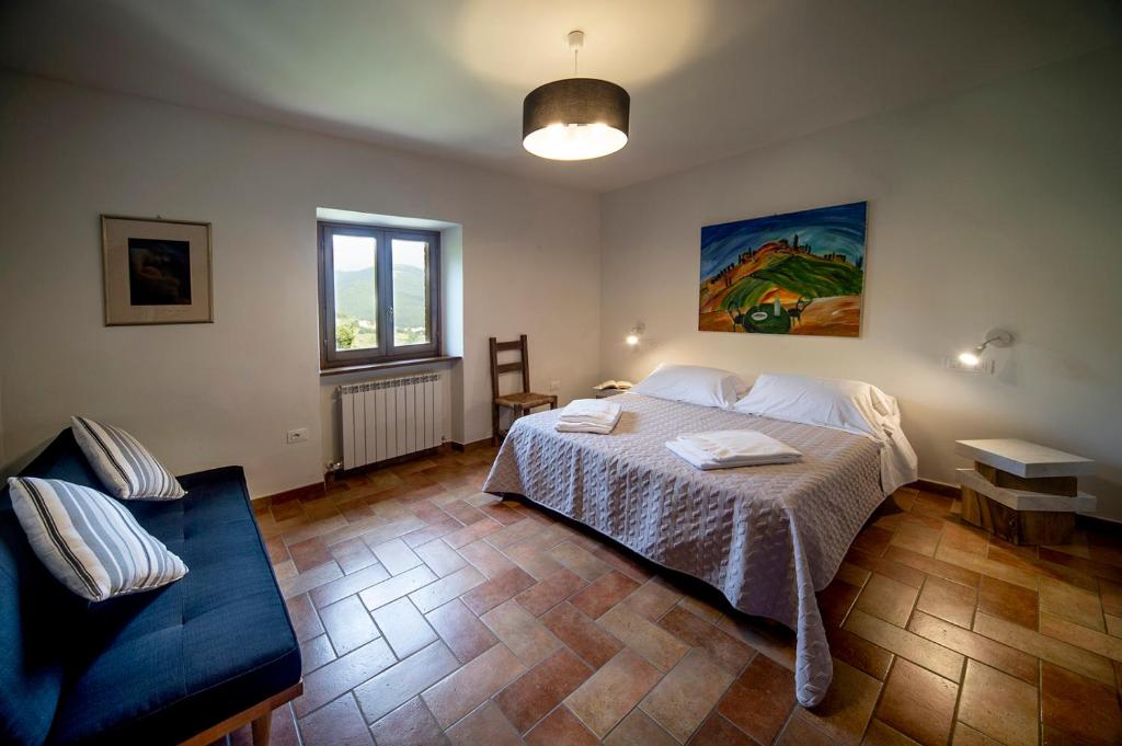Postel nebo postele na pokoji v ubytování Albergo Fontanelle