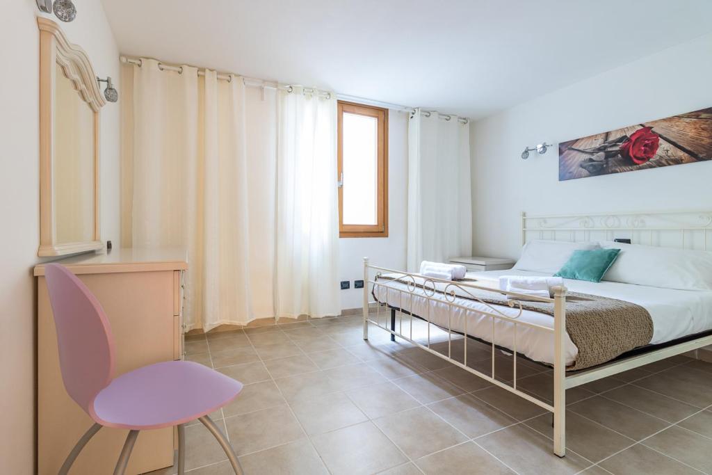 Postel nebo postele na pokoji v ubytování Apartment Gli Ulivi 4 - Tremezzina