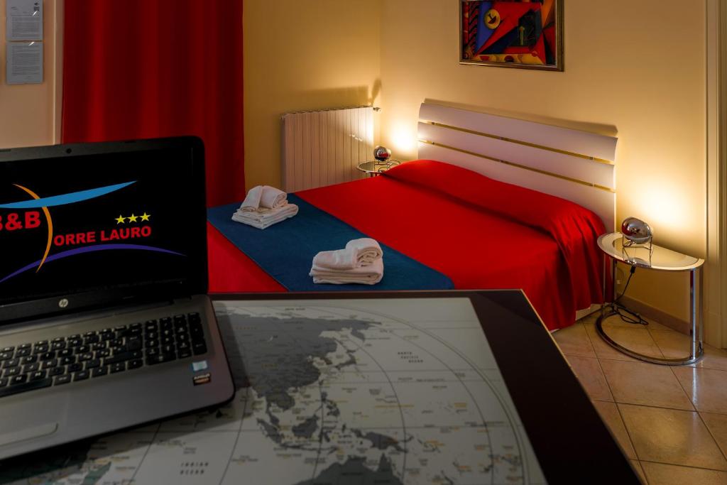 Postel nebo postele na pokoji v ubytování B&B Torre Lauro