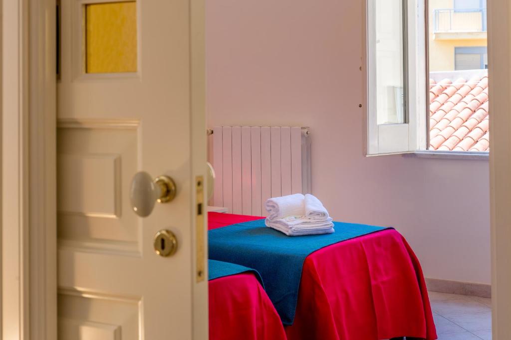 Postel nebo postele na pokoji v ubytování B&B Torre Lauro