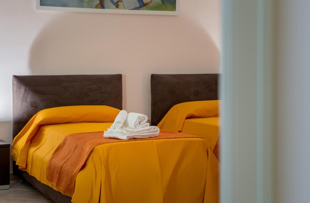 Postel nebo postele na pokoji v ubytování B&B Torre Lauro
