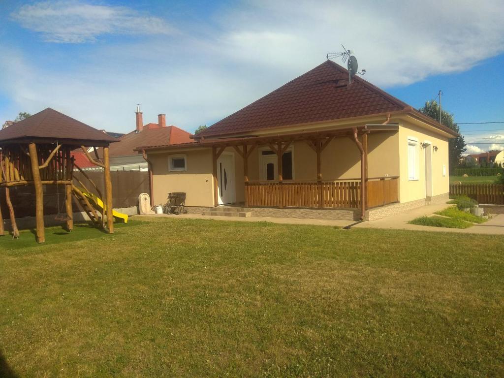a house with a gazebo in a yard at Family Holiday Home in Hajdúszoboszló