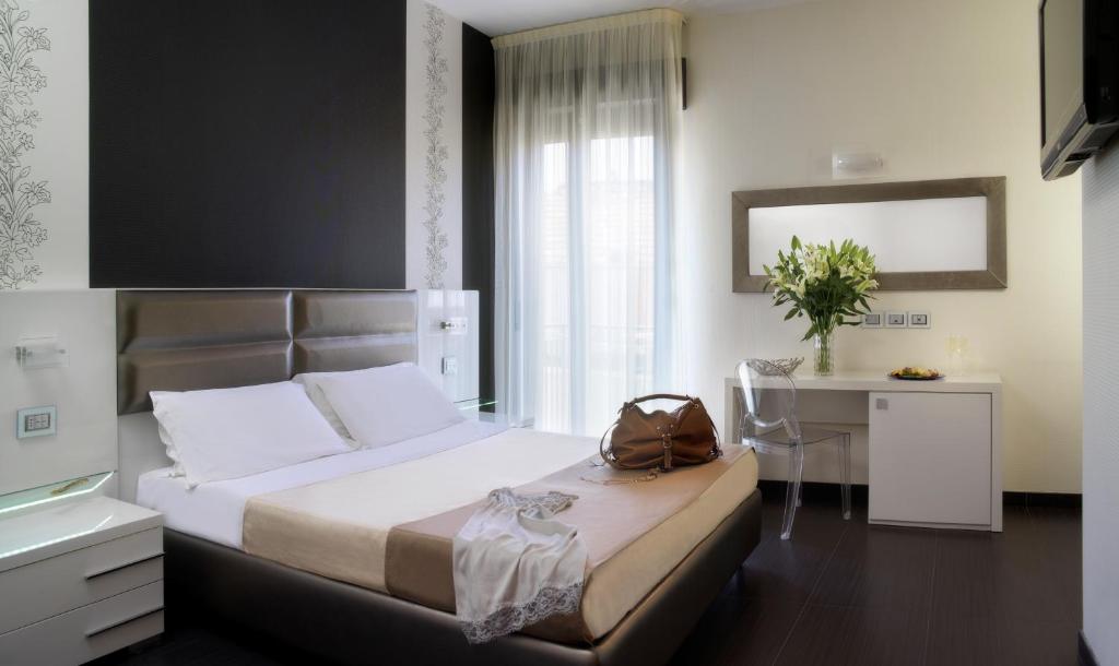 Postel nebo postele na pokoji v ubytování Hotel Vistamare