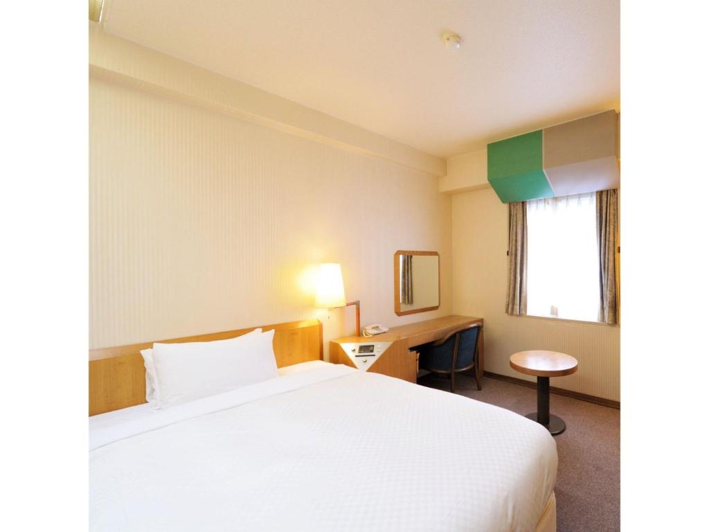 Ένα ή περισσότερα κρεβάτια σε δωμάτιο στο Court Hotel Fukuoka Tenjin - Vacation STAY 42333v