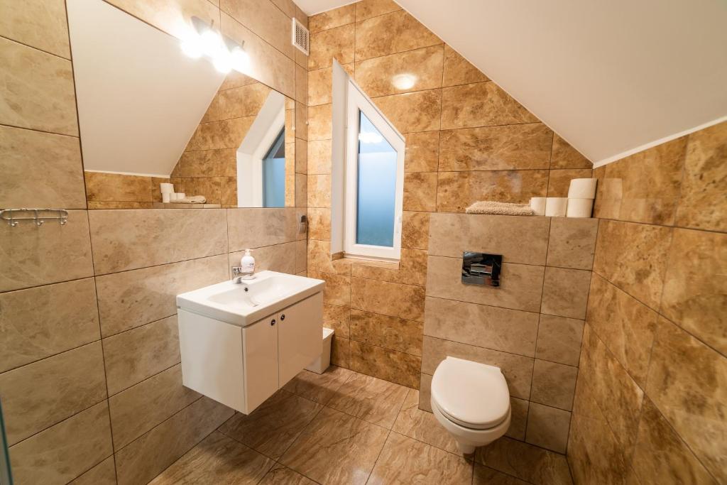 Kúpeľňa v ubytovaní Villa Mikołajki Popiełuszki 8
