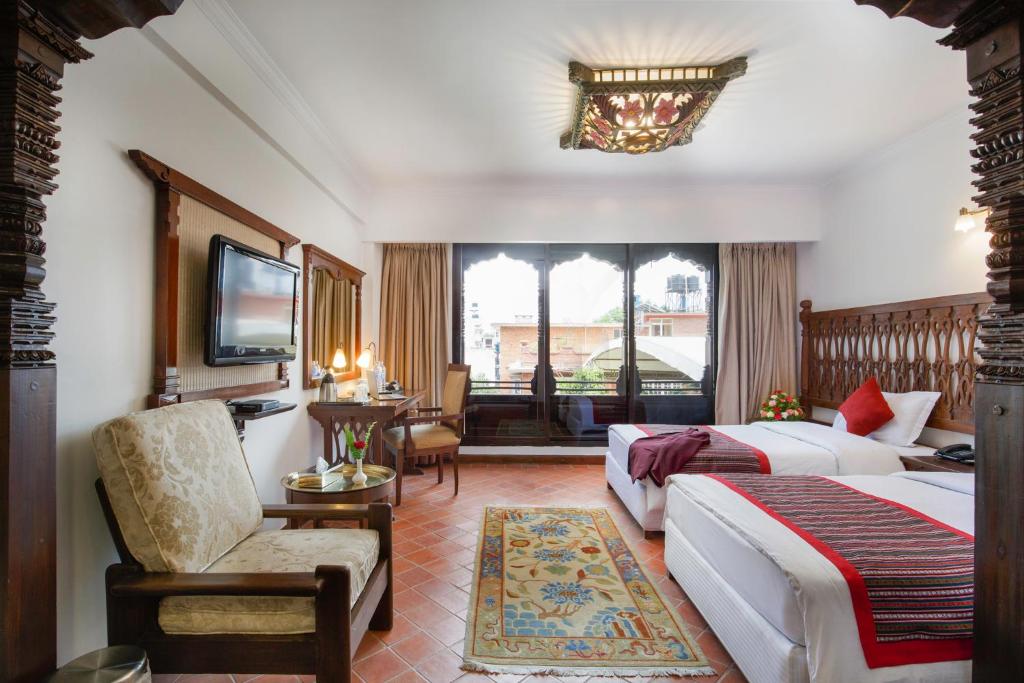 Postel nebo postele na pokoji v ubytování Hotel Manaslu