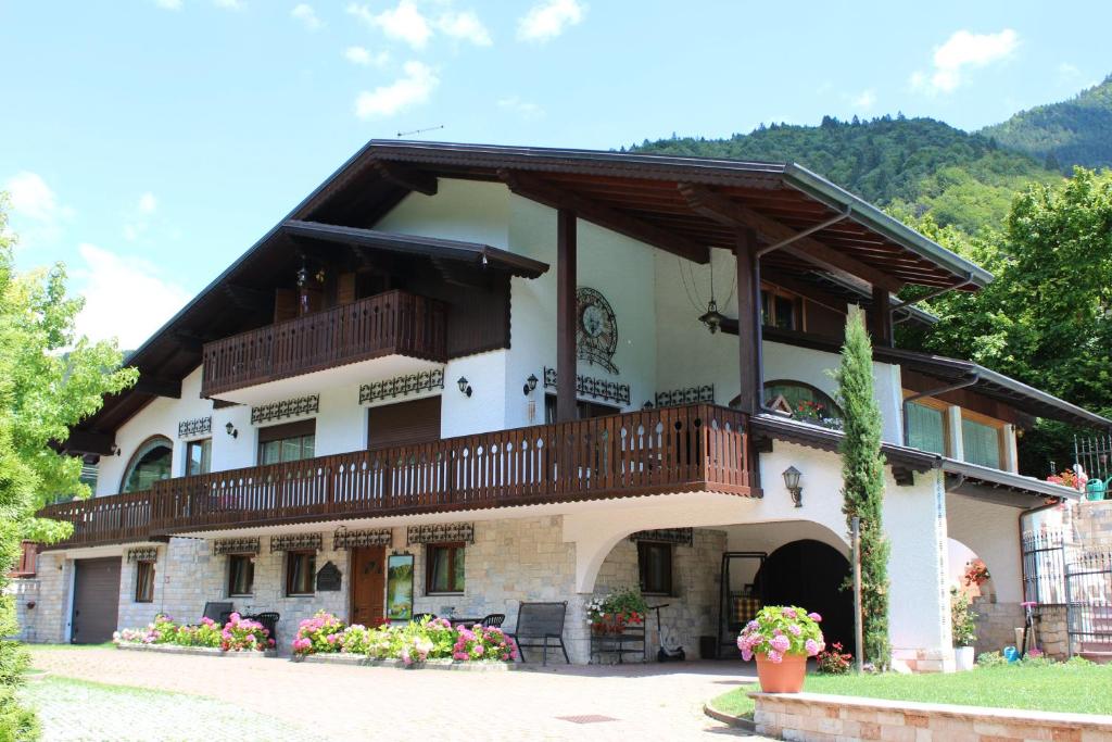 a building with balconies on the side of it at B&B Villa Cinzia Ledro in Ledro