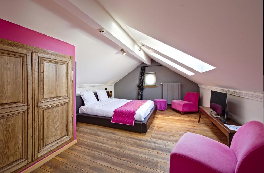 Postel nebo postele na pokoji v ubytování Hotel Saint-Amour
