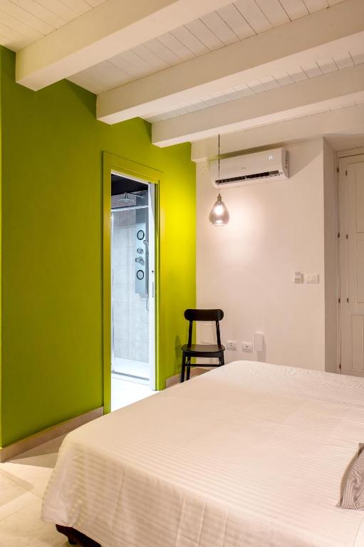 Łóżko lub łóżka w pokoju w obiekcie ORTIGIAdreamrooms 12