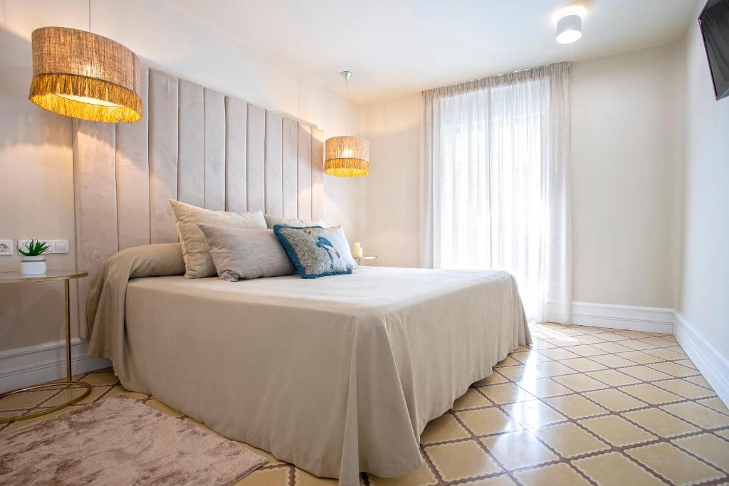 Posteľ alebo postele v izbe v ubytovaní Genteel Home Recogidas