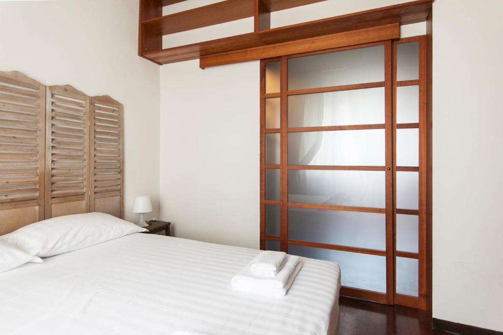 Posteľ alebo postele v izbe v ubytovaní De Angeli Cozy Apartment- Youhosty
