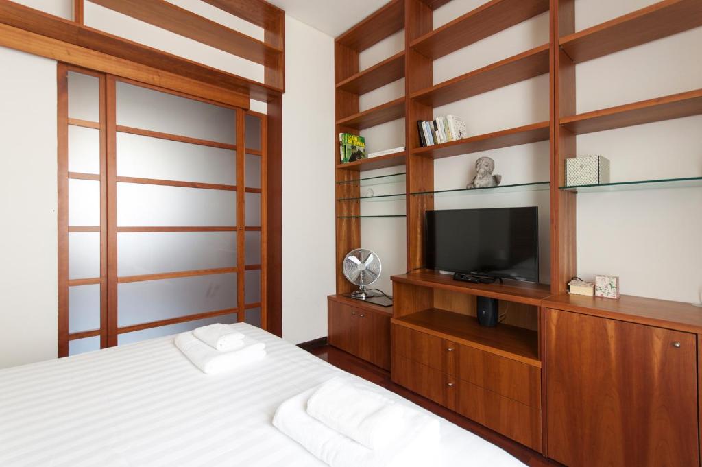 Televízia a/alebo spoločenská miestnosť v ubytovaní De Angeli Cozy Apartment- Youhosty