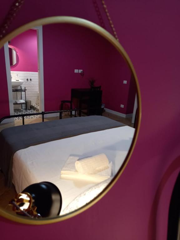 Łóżko lub łóżka w pokoju w obiekcie B&B Stella Scugnizza