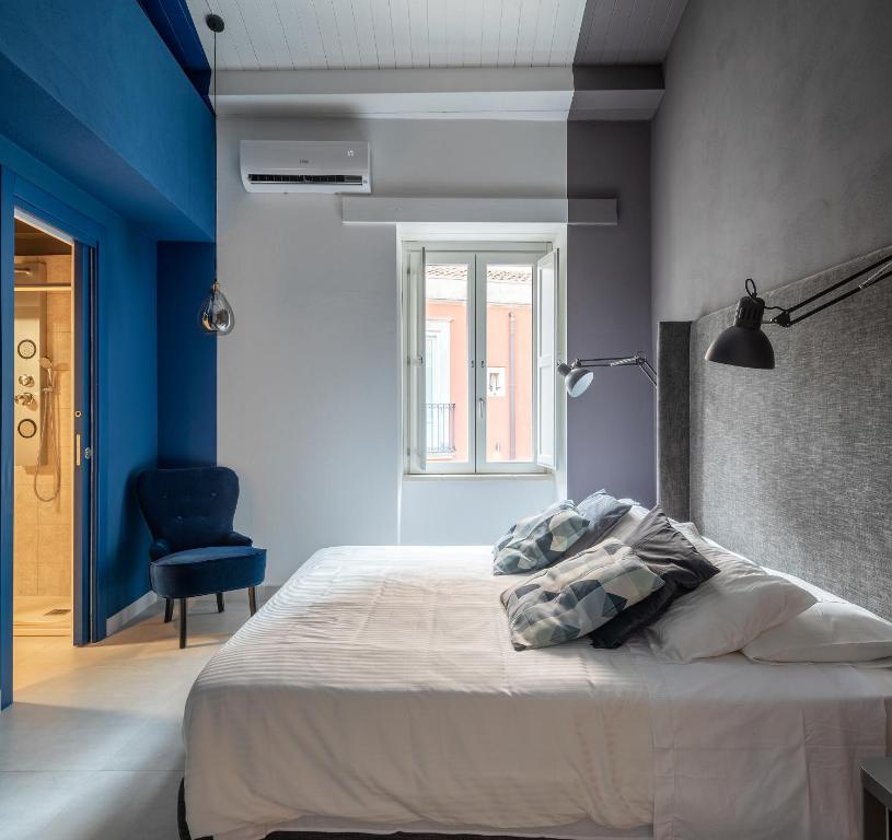 Łóżko lub łóżka w pokoju w obiekcie ORTIGIAdreamrooms 14