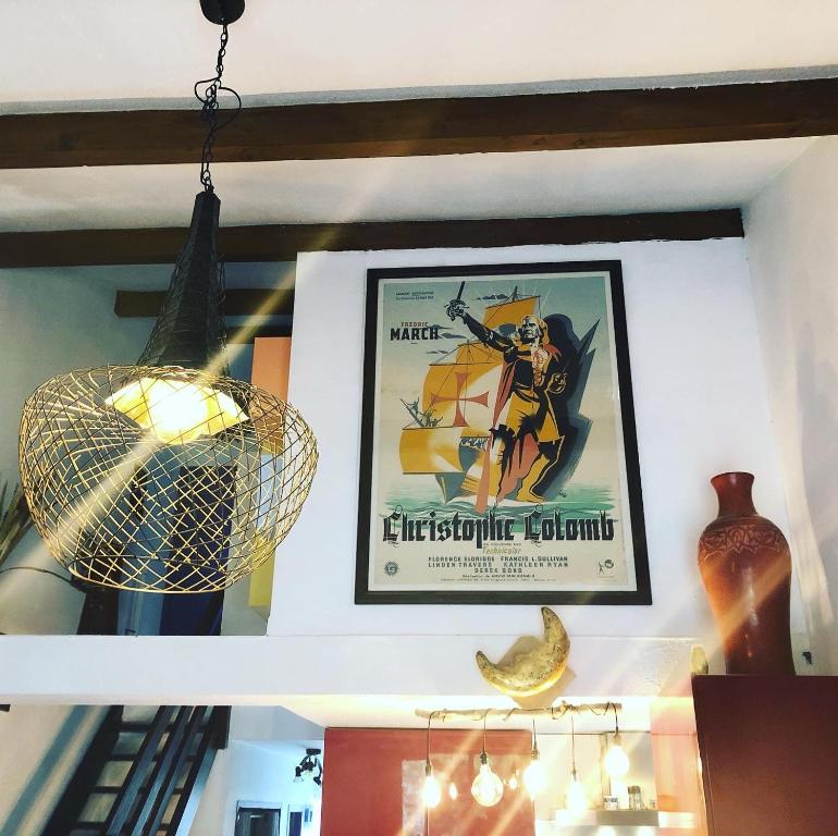 a picture hanging on a wall with a picture at La cabane de Biscarrosse in Biscarrosse-Plage