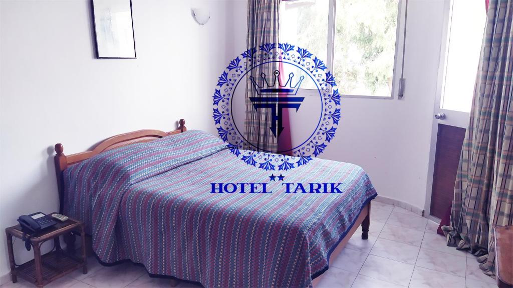 Postel nebo postele na pokoji v ubytování HOTEL TARIK Fnideq
