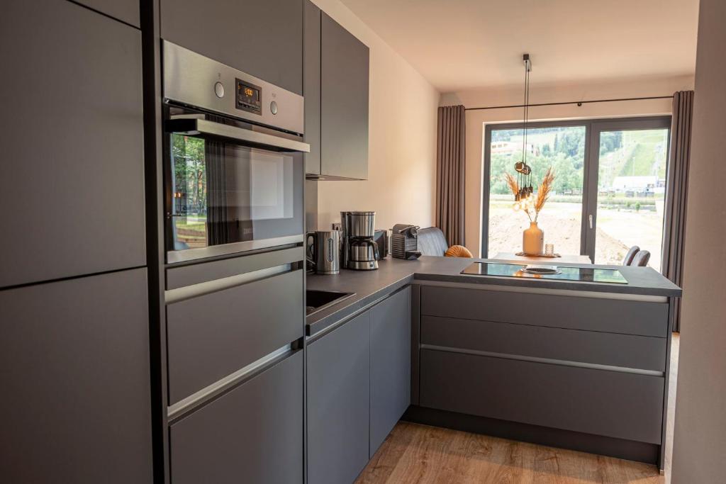 Kuchyňa alebo kuchynka v ubytovaní Kreischberg Suites by ALPS RESORTS