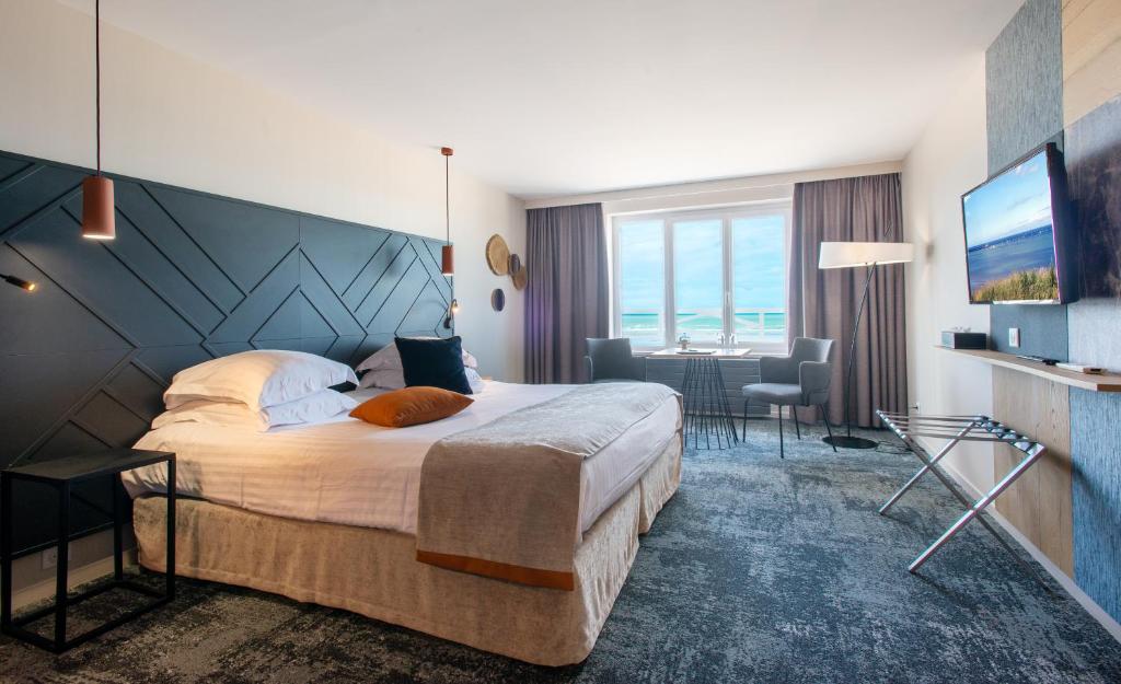 Кровать или кровати в номере Hotel Atlantic