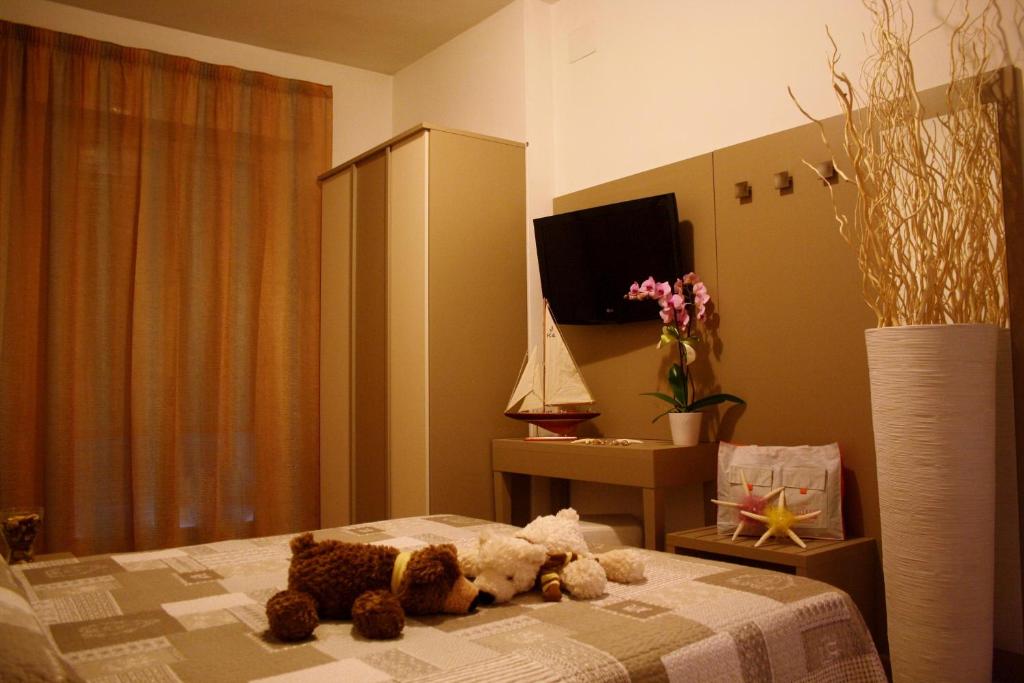 Postel nebo postele na pokoji v ubytování Hotel Camelia