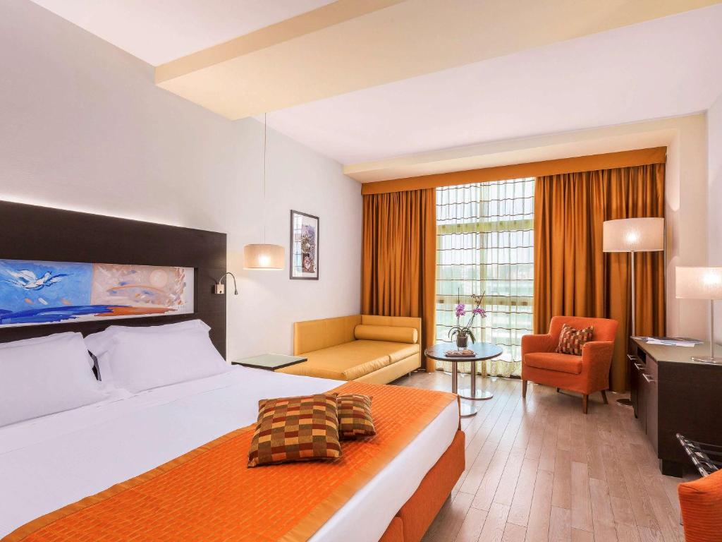 Postel nebo postele na pokoji v ubytování Hotel Mercure Siracusa