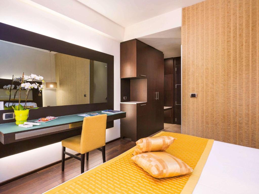 Postel nebo postele na pokoji v ubytování Hotel Mercure Siracusa