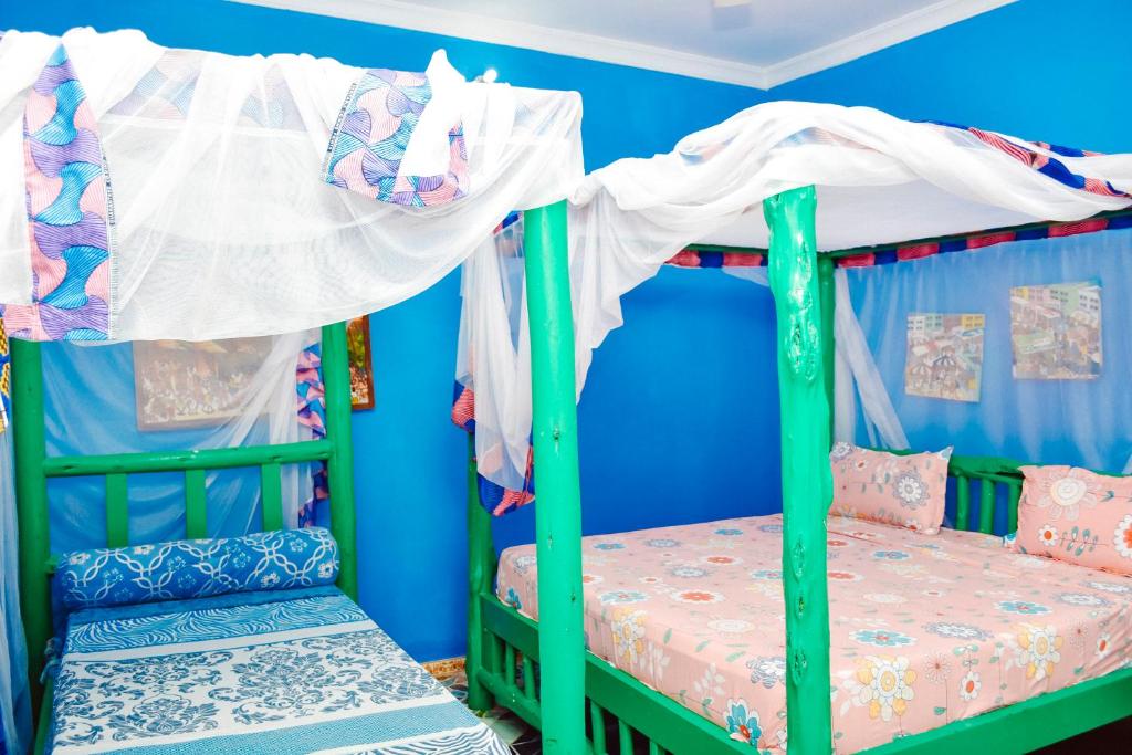 Postel nebo postele na pokoji v ubytování Coccobello Zanzibar