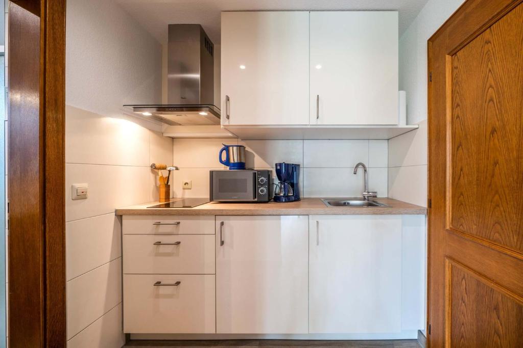 Kuchyň nebo kuchyňský kout v ubytování Hotel Seepark Appartements