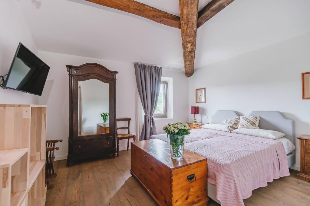 Postel nebo postele na pokoji v ubytování Agriturismo Le Fonti