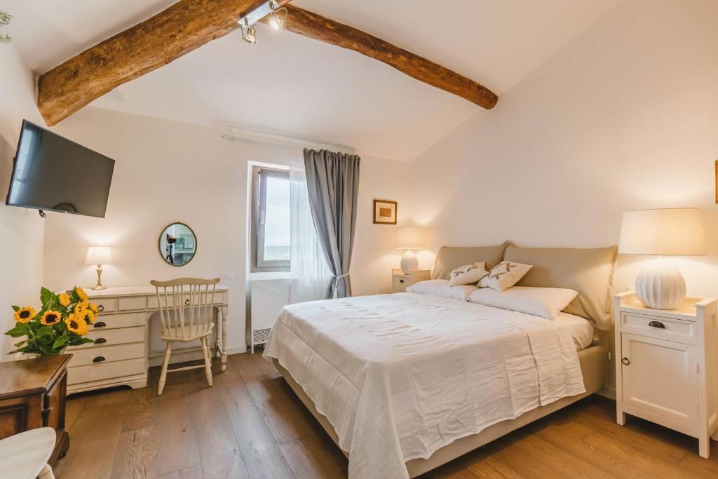 Postel nebo postele na pokoji v ubytování Agriturismo Le Fonti