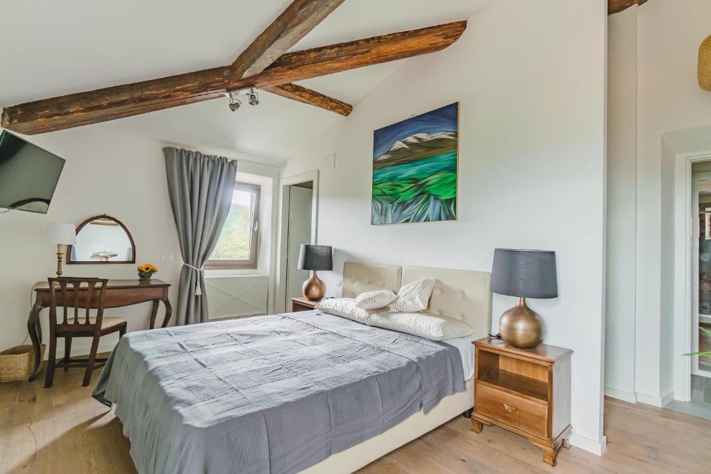 Postel nebo postele na pokoji v ubytování Agriturismo Le Fonti
