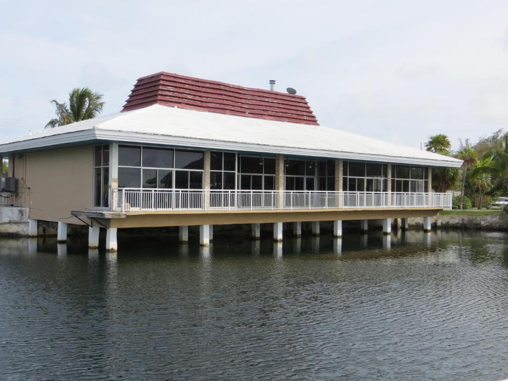a building on a dock on a body of water at Sugarloaf Lodge in Sugarloaf Shores