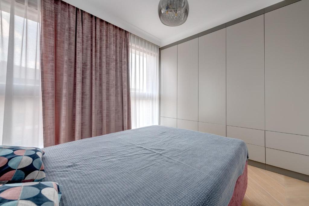 Posteľ alebo postele v izbe v ubytovaní Unique Apartments - Browar Gdański