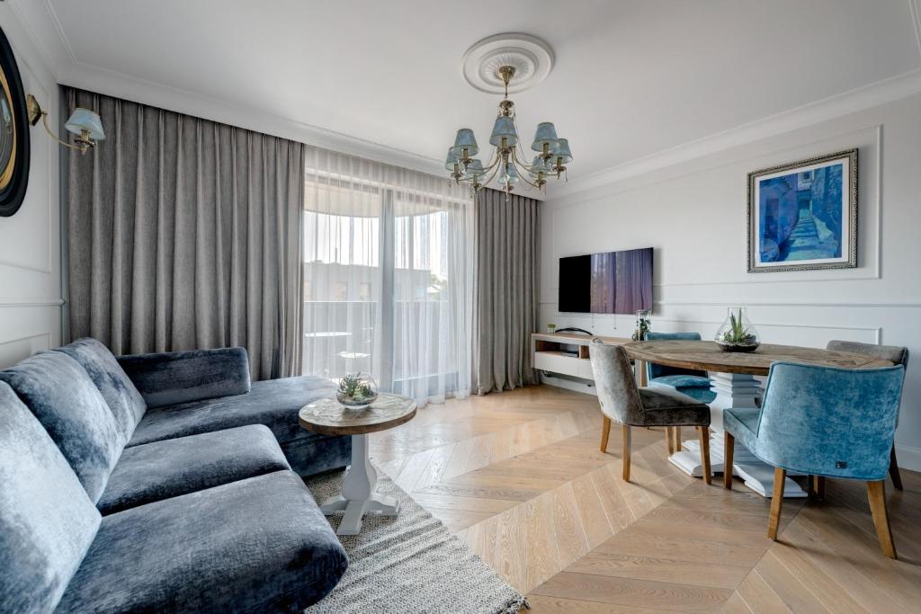 Televízia a/alebo spoločenská miestnosť v ubytovaní Unique Apartments - Browar Gdański