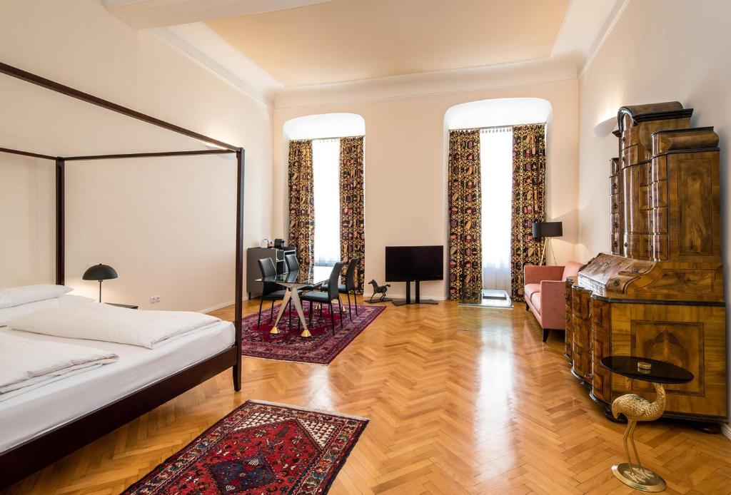 Postel nebo postele na pokoji v ubytování Boutique Hotel Dom - Rooms & Suites