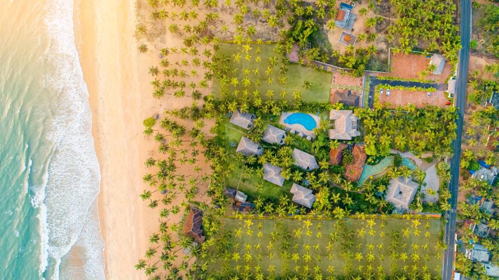 an overhead view of a beach and the ocean at Malabar Ocean Front Resort And Spa, Bekal in Nīleshwar