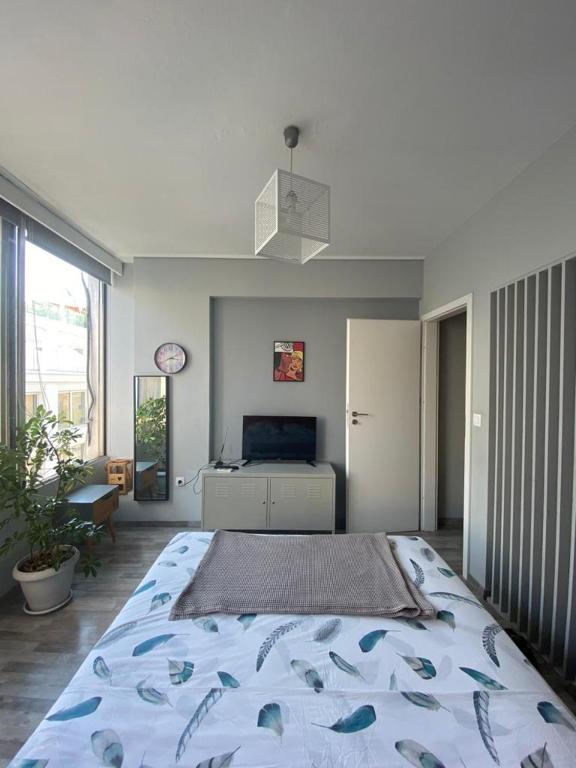 Postel nebo postele na pokoji v ubytování Ermou 18 Mosaics boutique apartment