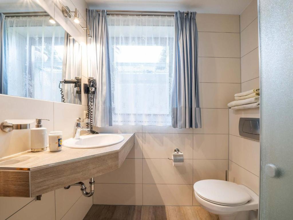 Koupelna v ubytování Hotel Seepark Appartements