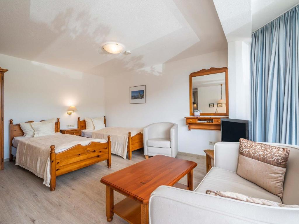 Postel nebo postele na pokoji v ubytování Hotel Seepark Appartements