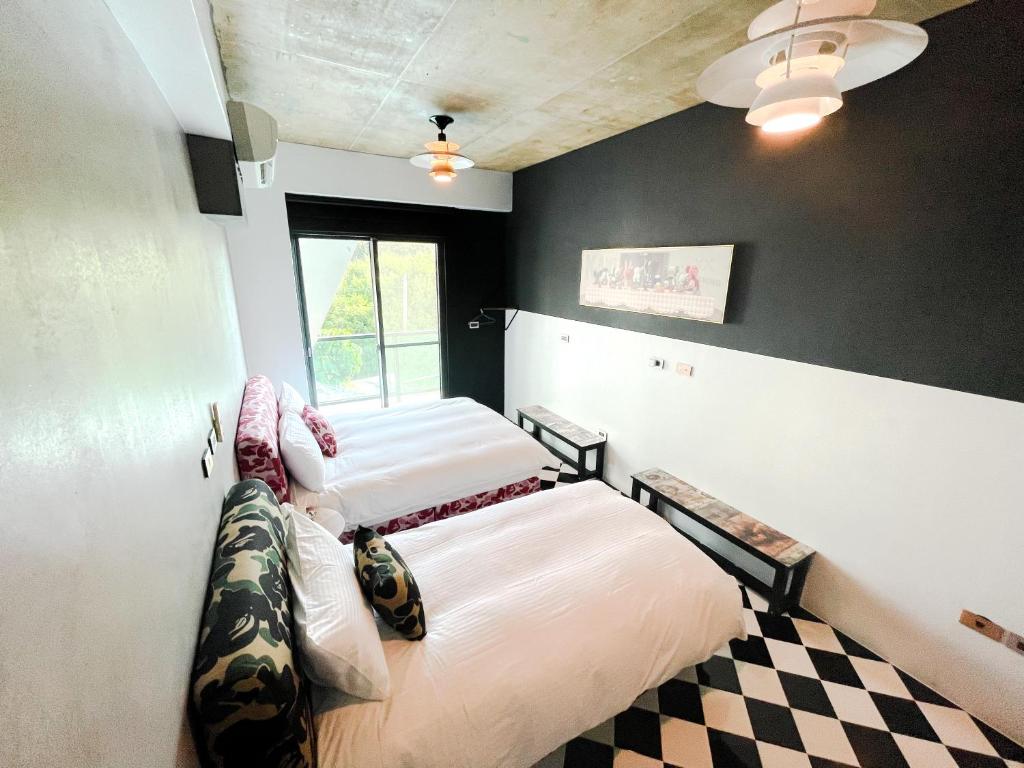 Postel nebo postele na pokoji v ubytování Noah's Ark Homestay