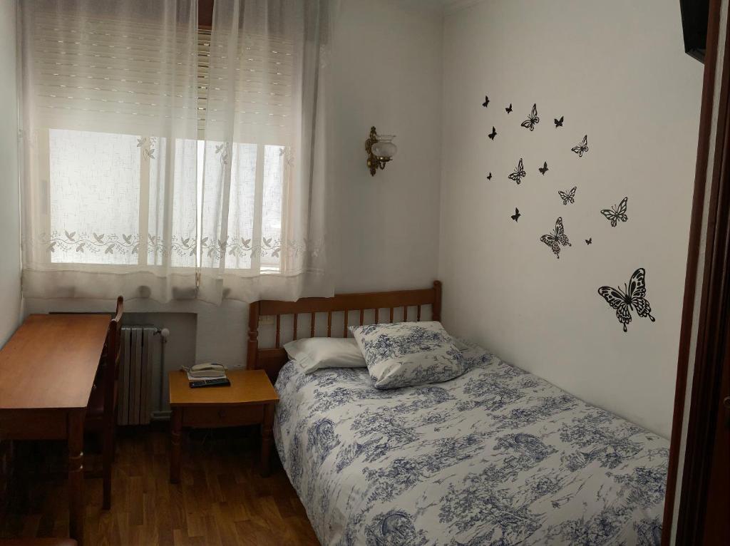 Postel nebo postele na pokoji v ubytování Hotel España