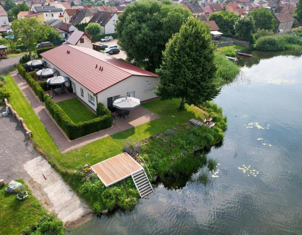 an aerial view of a house on an island in the water at Ferienanlage Pritzerbe in Pritzerbe